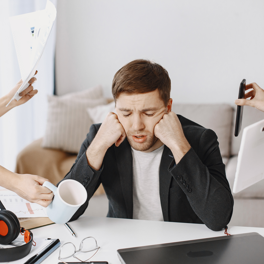 man-sitting-living-room-home-sad-man-tired-from-work